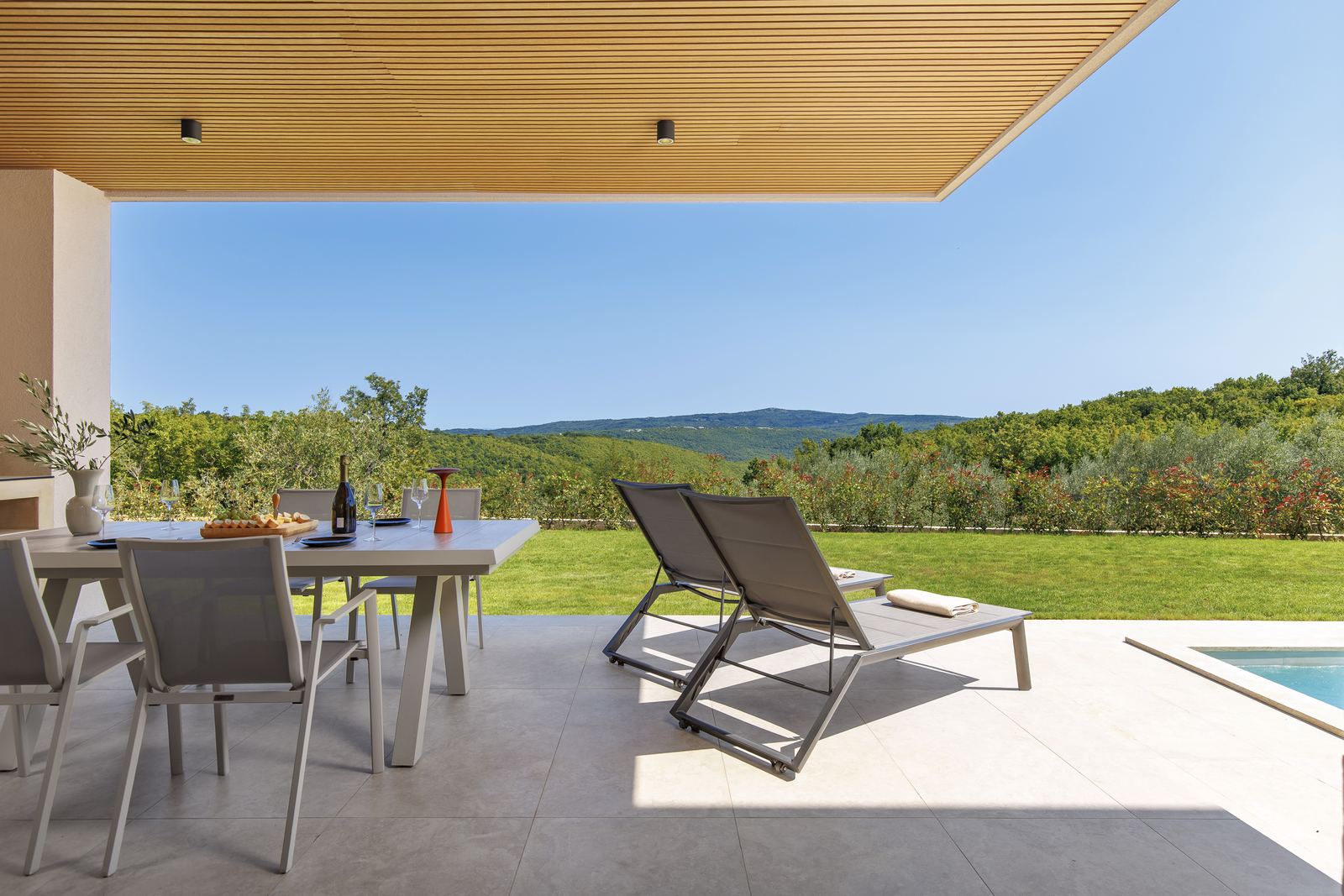 Covered terrace dining area by the pool
