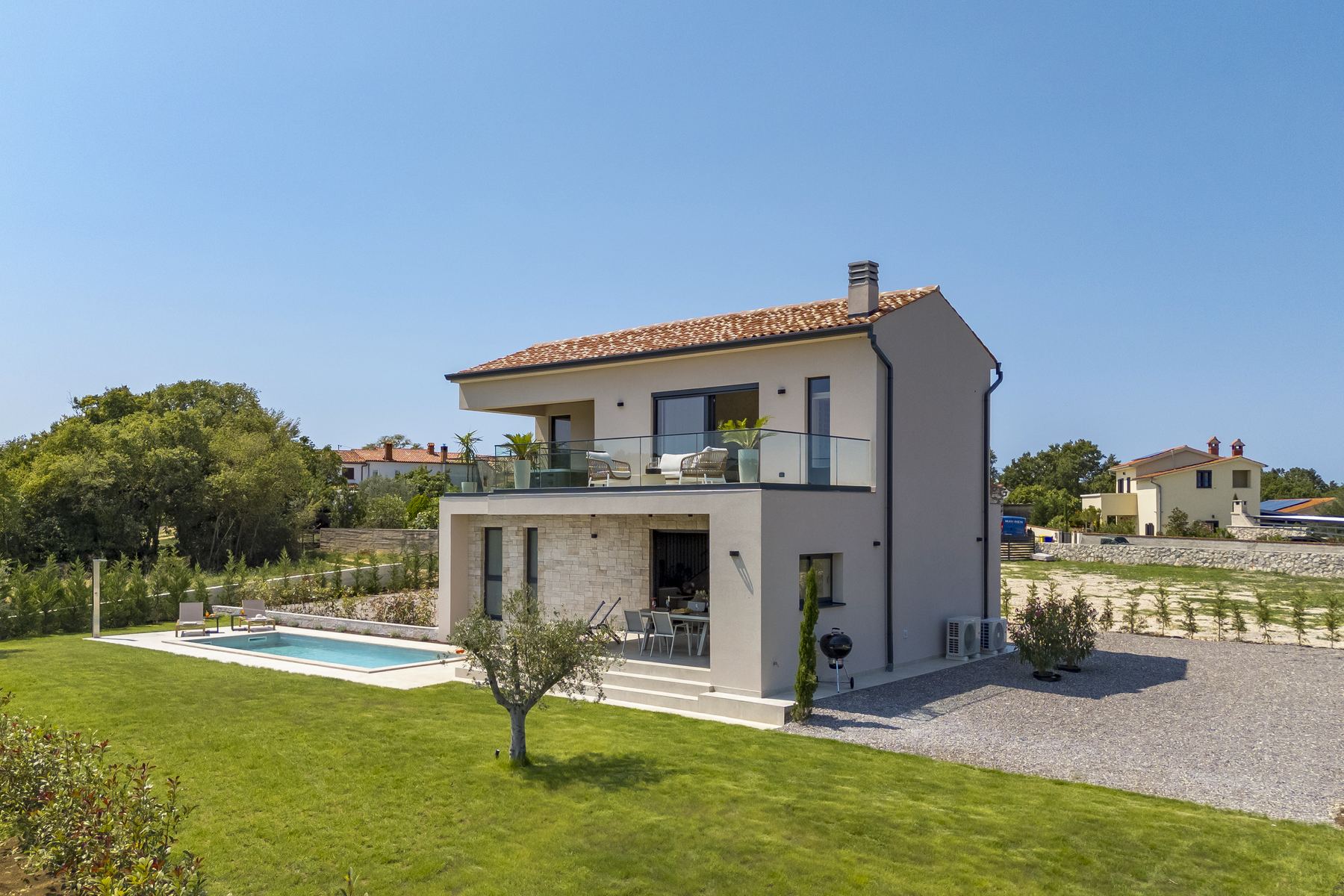 Aerial view of the villa, pool and olive groves around Kunj